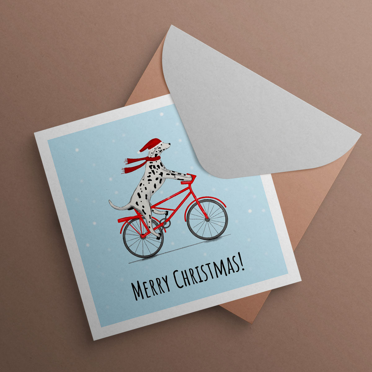 Dalmatian riding bike in the snow with Santa hat. illustrated by Kitty's Art