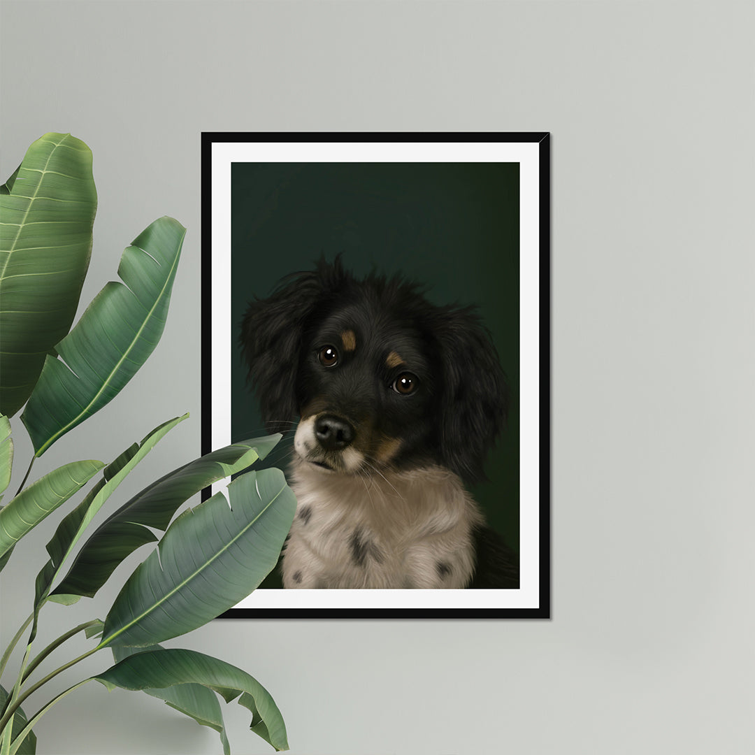 Framed portrait of a dog on a gray wall with a plant to the left.