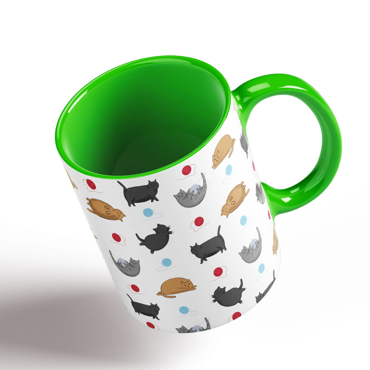 Cute Fat Cats pattern separated by balls of wool. Green Handle and interior.