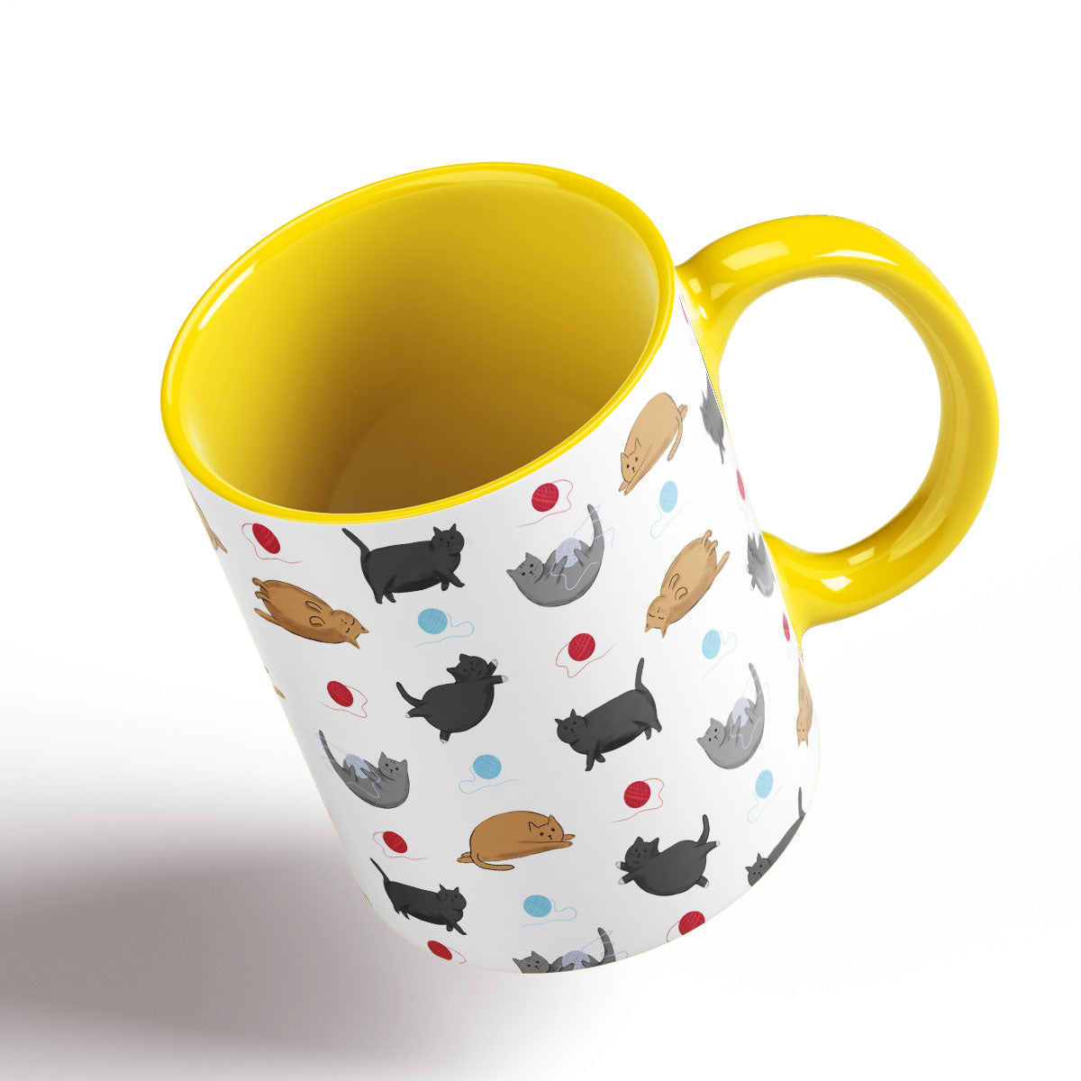 Cute Fat Cats pattern separated by balls of wool illustrated by Oundle, Peterborough Artist Kitty's Art. Yellow Handle and interior.