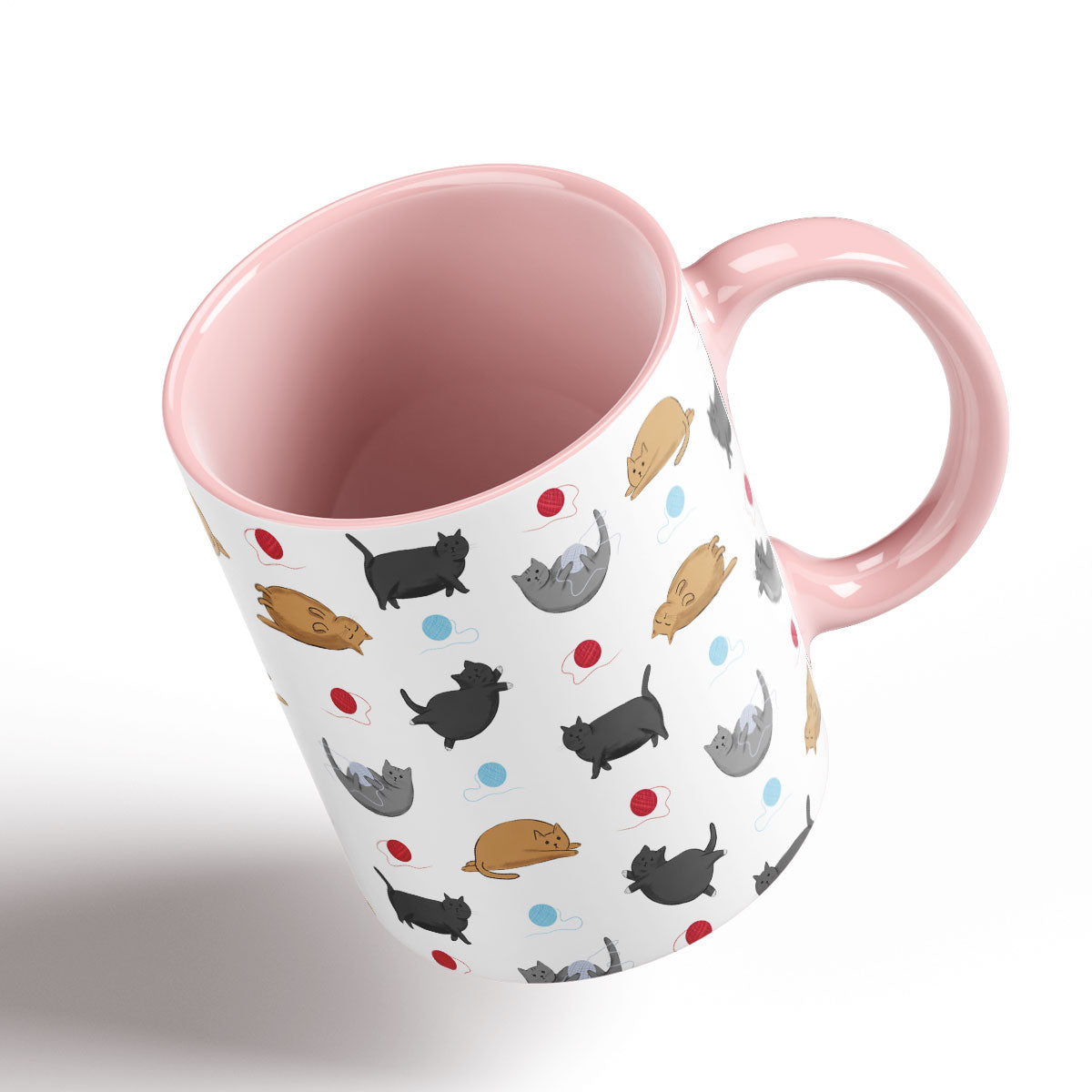 Cute Fat Cats pattern separated by balls of wool. Pink Handle and interior.